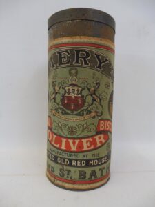 A tall metal tin used for storing Bath Oliver crackers